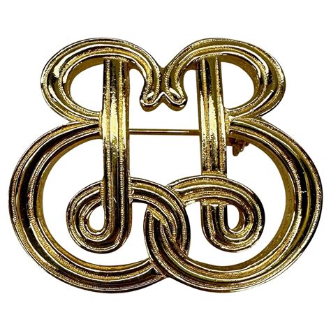 gold burberry pins for women.